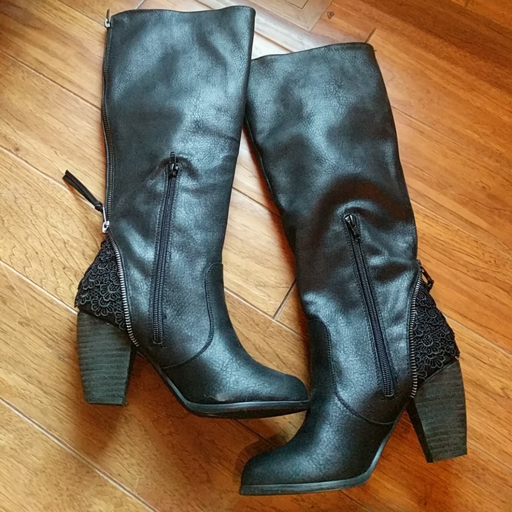 Women's black heeled boots.